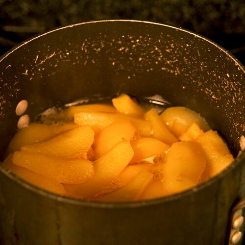 simmering fruit in a pot