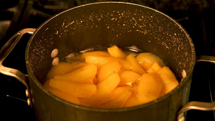 simmering fruit in a pot