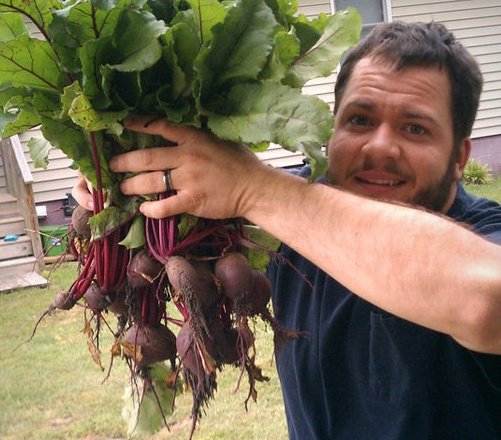 Odom-Beets Holding up a bounty of Odom Beets