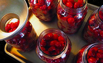Canned cherries in glass jars