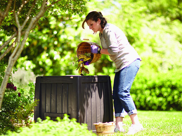 woman composting outside