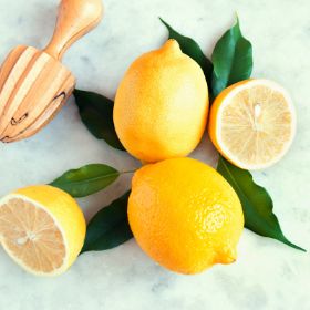 Lemon on kitchen counter with juicer