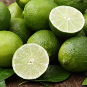 Pile of limes with one cut open