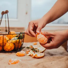 Clementine Mandarin being peeled