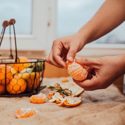 Clementine Mandarin being peeled