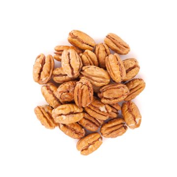 Freshly shelled pecans on white surface