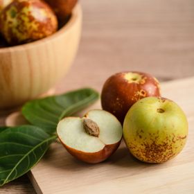 View full size image Jujube cut open on cutting board