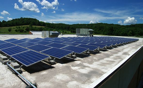 Read the full article Solar panels on roof of main office building