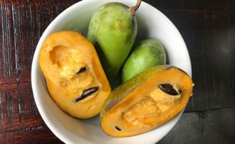 Fresh paw paw fruit in bowl