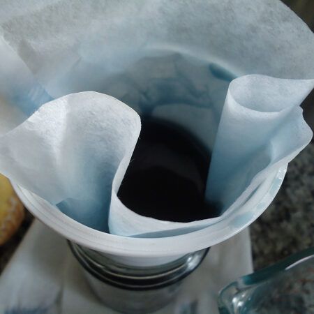 Straining Berry Liqueur Berry Liqueur Strained Through a Filter
