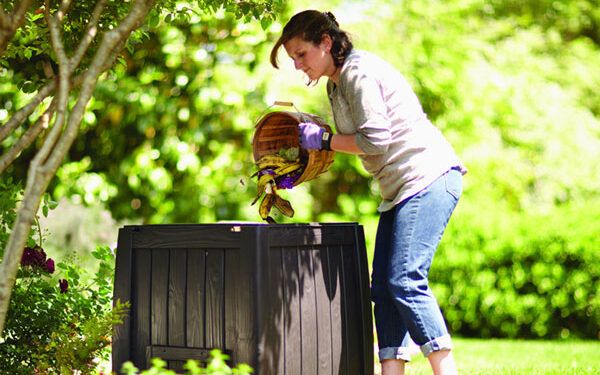 woman composting outside