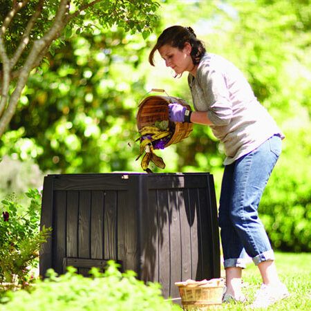 woman composting outside